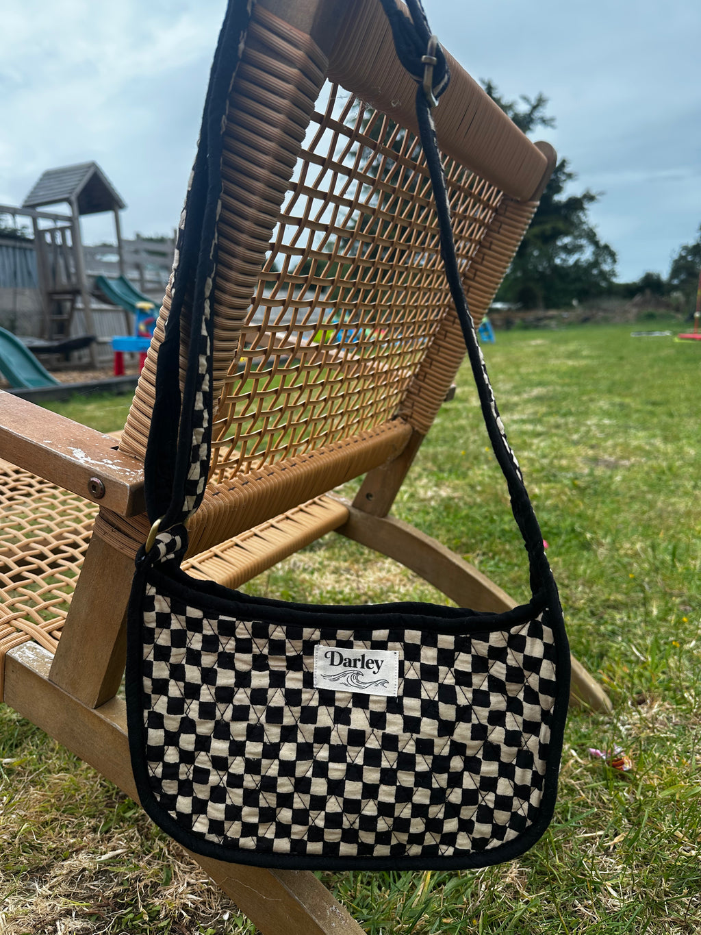 Checkered black and cream side bag