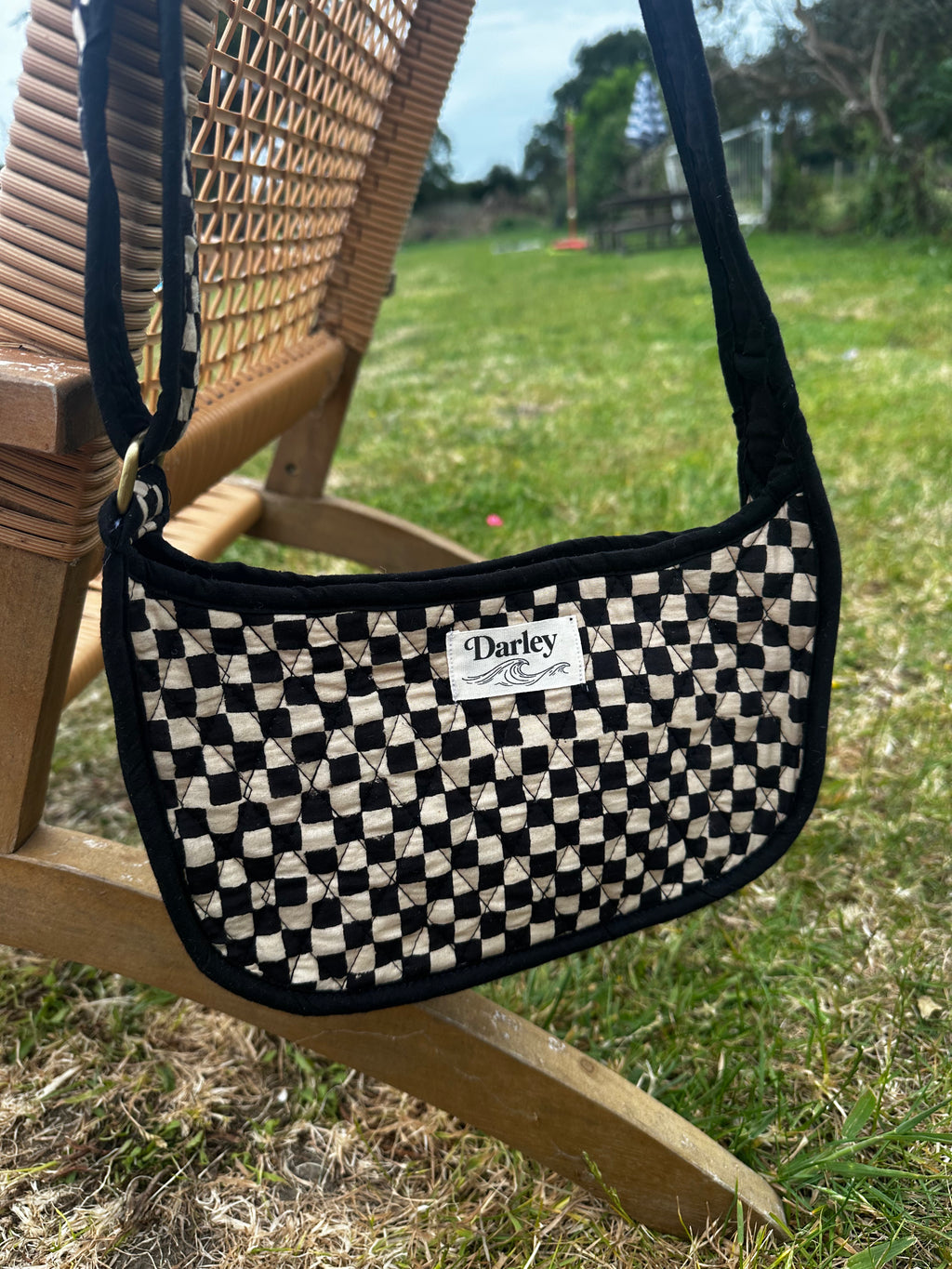 Checkered black and cream side bag
