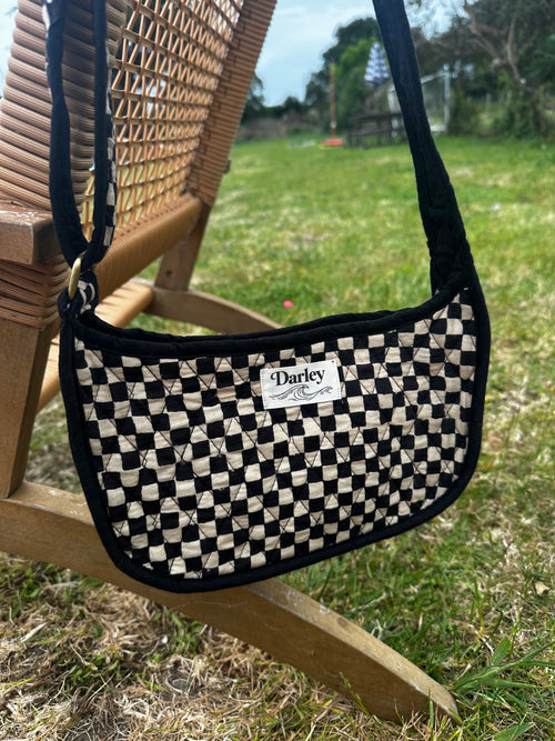 Checkered black and cream side bag