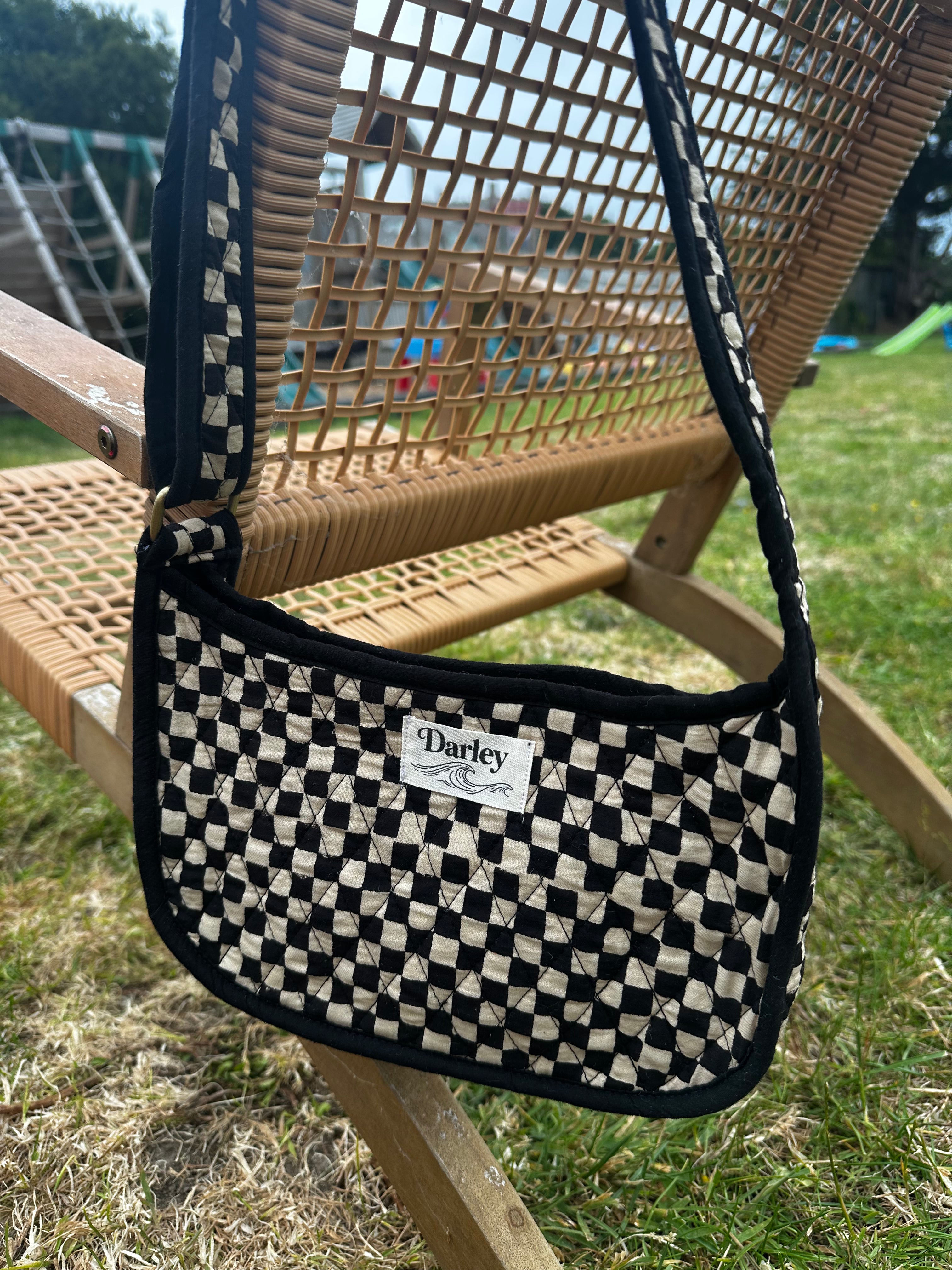 Checkered black and cream side bag