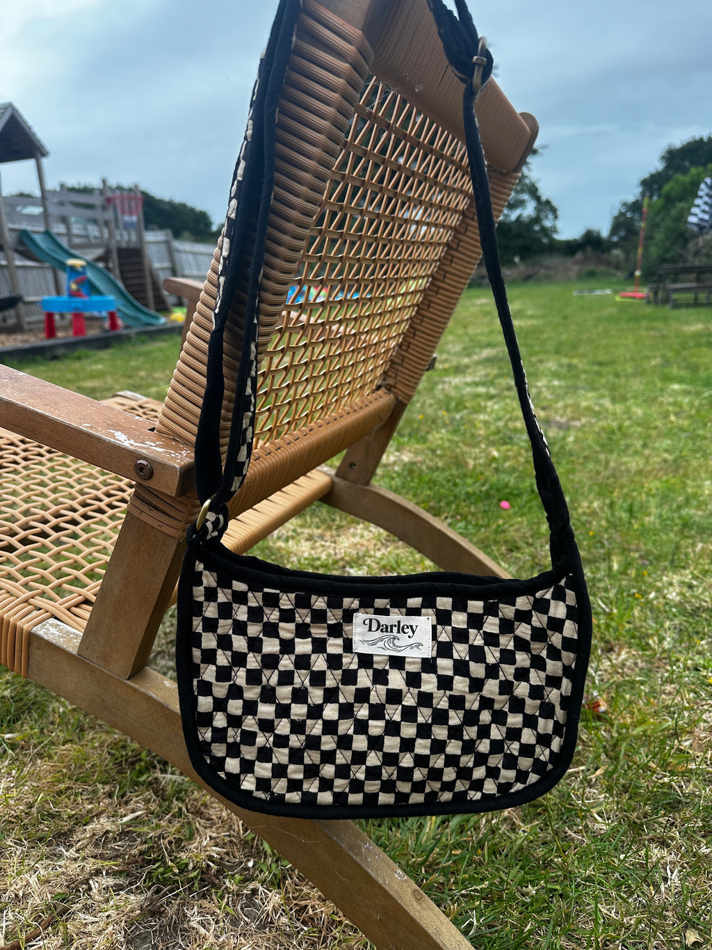 Checkered black and cream side bag