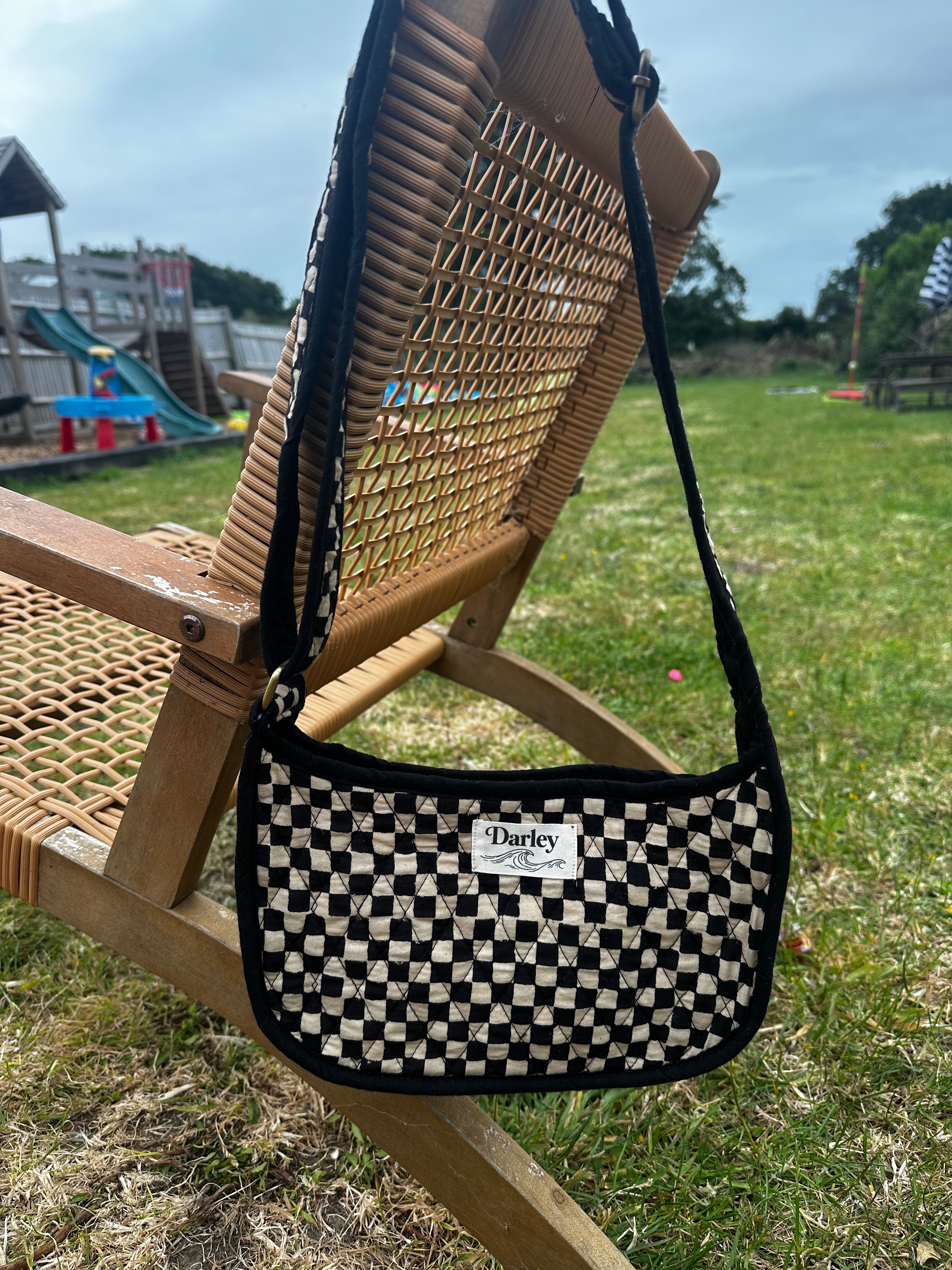 Checkered black and cream side bag